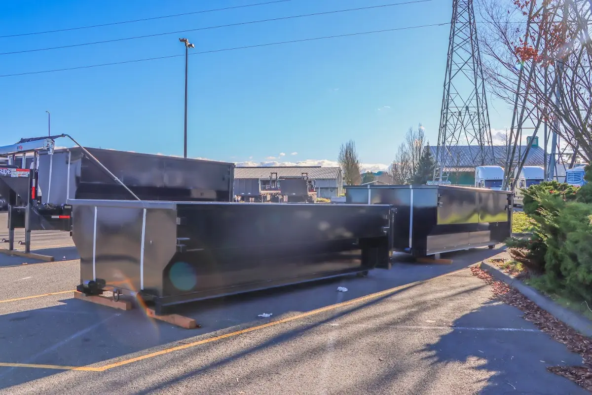 Roll-off dumpster ready for waste disposal at job site for 2 Yard Dumpster Rental in Epping